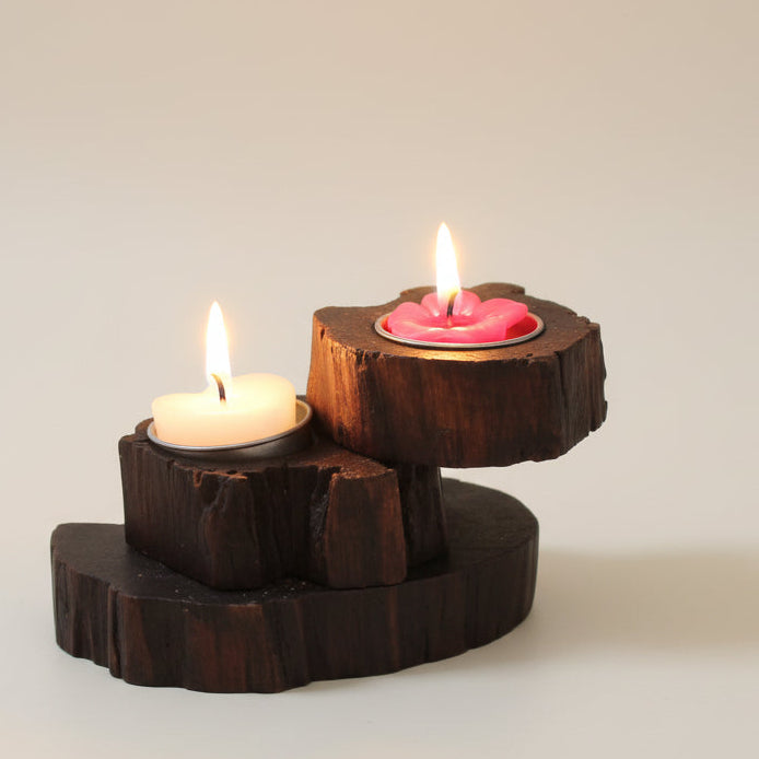 Hand-carved rustic wood candle holder featuring a multi-tier spiral design, ideal for a vintage dining table centerpiece and cozy home decor.