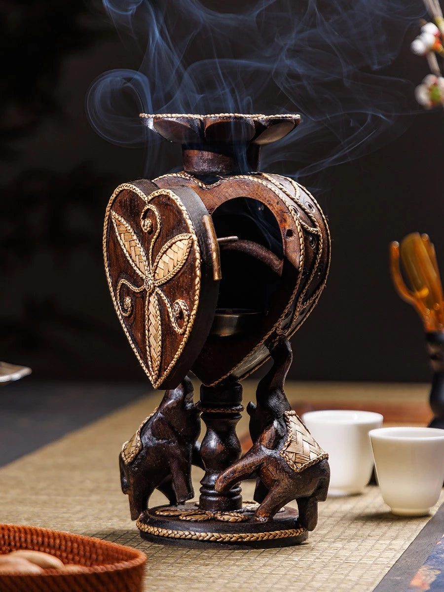 Hand-carved 2-in-1 solid wood incense cone burner and tealight candle holder supported by a stable pair of elephants.