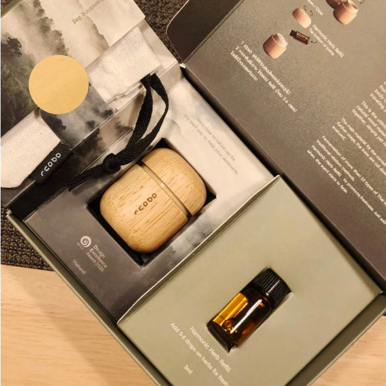 Award-winning minimalist wooden Thai herbal inhaler in a handcrafted jar, professional Thai aromatherapy gift.