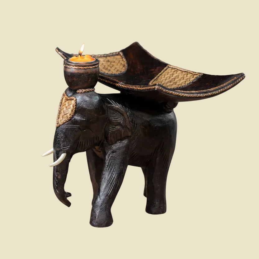 Heavy-duty wooden elephant fruit tray serving centerpiece on a dining table