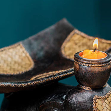 Heavy-duty wooden elephant fruit tray serving centerpiece on a dining table