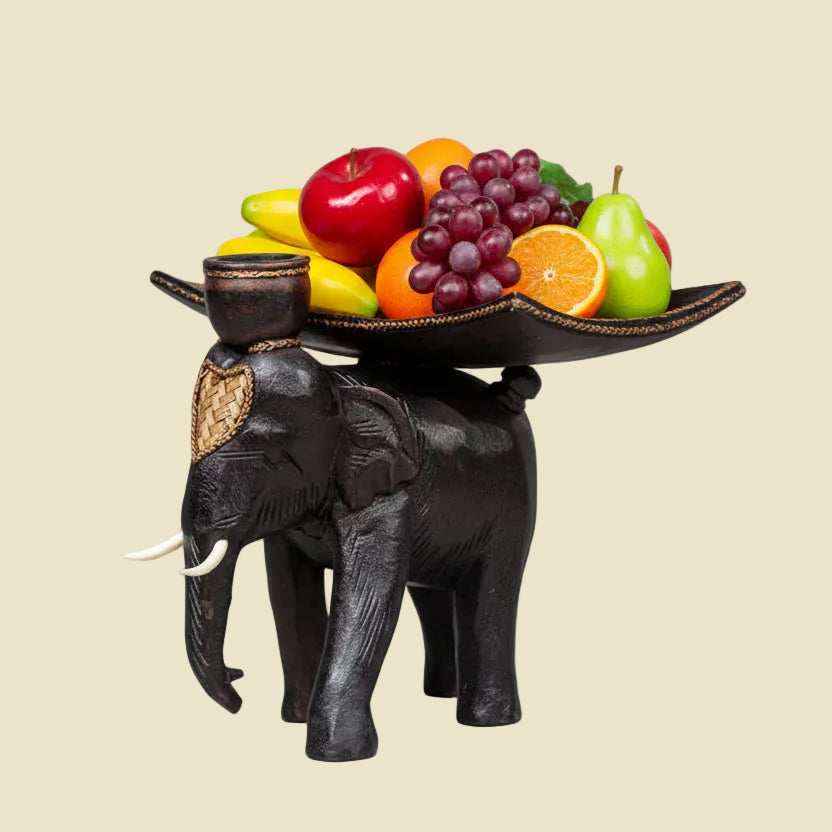 Heavy-duty wooden elephant fruit tray serving centerpiece on a dining table
