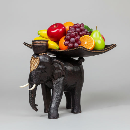 Heavy-duty wooden elephant fruit tray serving centerpiece on a dining table