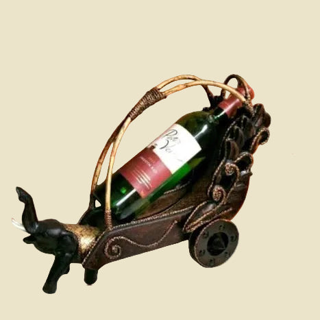 Handcrafted Thai elephant wine bottle holder carved from Rain Tree wood with a woven rattan barrel, premium artisan home decor.