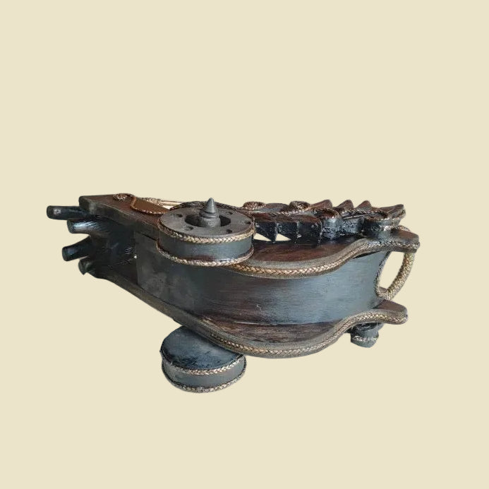 Handcrafted Thai elephant wine bottle holder carved from Rain Tree wood with a woven rattan barrel, premium artisan home decor.