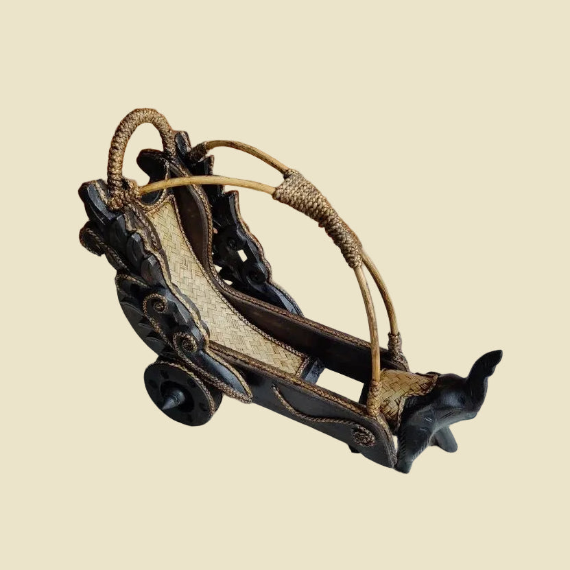 Handcrafted Thai elephant wine bottle holder carved from Rain Tree wood with a woven rattan barrel, premium artisan home decor.