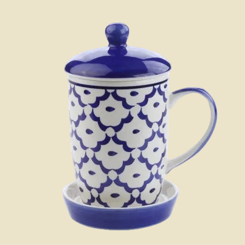Hand-painted ceramic coffee mug with lid and saucer from Lampang, featuring blue and white artisan patterns, 13oz stoneware.