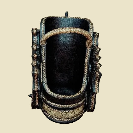 Handcrafted Thai elephant wine bottle holder carved from Rain Tree wood with woven rattan accents, model DC1010, premium tabletop decor.