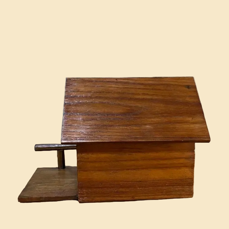Handcrafted rustic wood bird house made from reclaimed teak wood, featuring a cozy cabin design for outdoor garden decor.