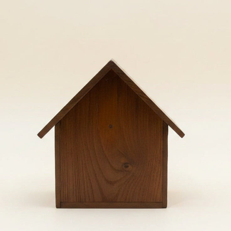 Handcrafted rustic wood bird house made from reclaimed teak wood, featuring a cozy cabin design for outdoor garden decor.