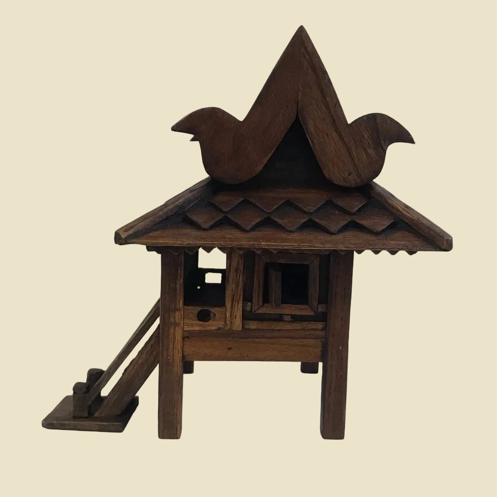 Handcrafted authentic Thai teak wood miniature spirit house and traditional Zen shrine.