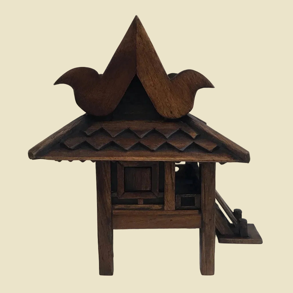 Handcrafted authentic Thai teak wood miniature spirit house and traditional Zen shrine.