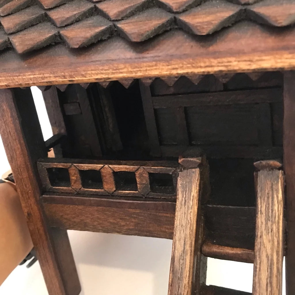 Handcrafted authentic Thai teak wood miniature spirit house and traditional Zen shrine.