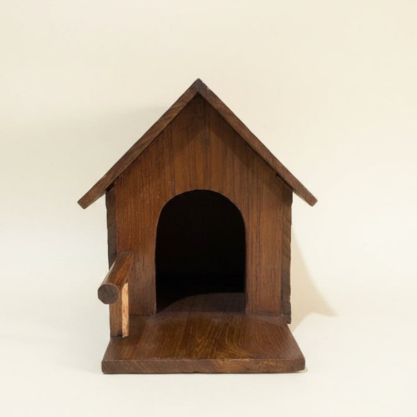 Handcrafted rustic wood bird house made from reclaimed teak wood, featuring a cozy cabin design for outdoor garden decor.