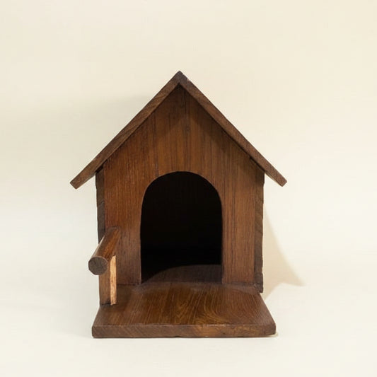 Handcrafted rustic wood bird house made from reclaimed teak wood, featuring a cozy cabin design for outdoor garden decor.