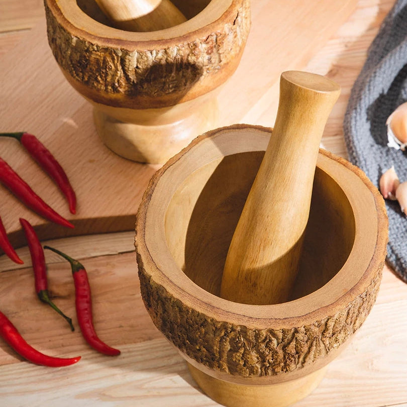 Close-up of a thick-walled wooden mortar bowl showing the 2.5cm depth for easy garlic grinding.
