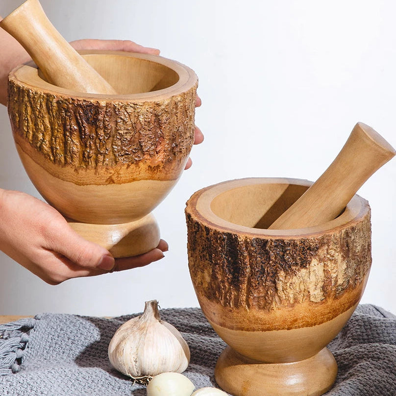 Close-up of a thick-walled wooden mortar bowl showing the 2.5cm depth for easy garlic grinding.