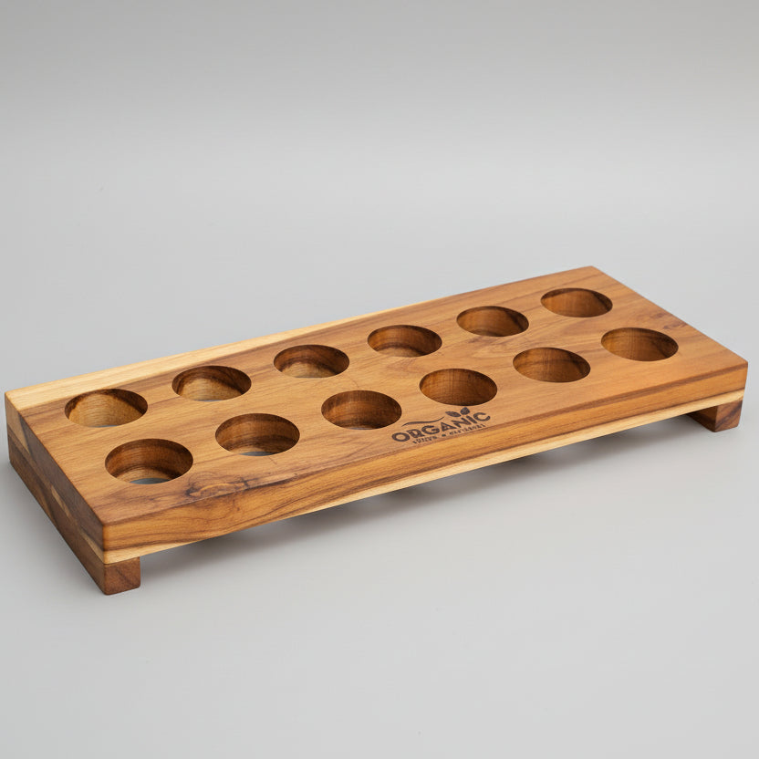12-slot handcrafted teak wood egg tray with fresh brown eggs on a green leaf background
