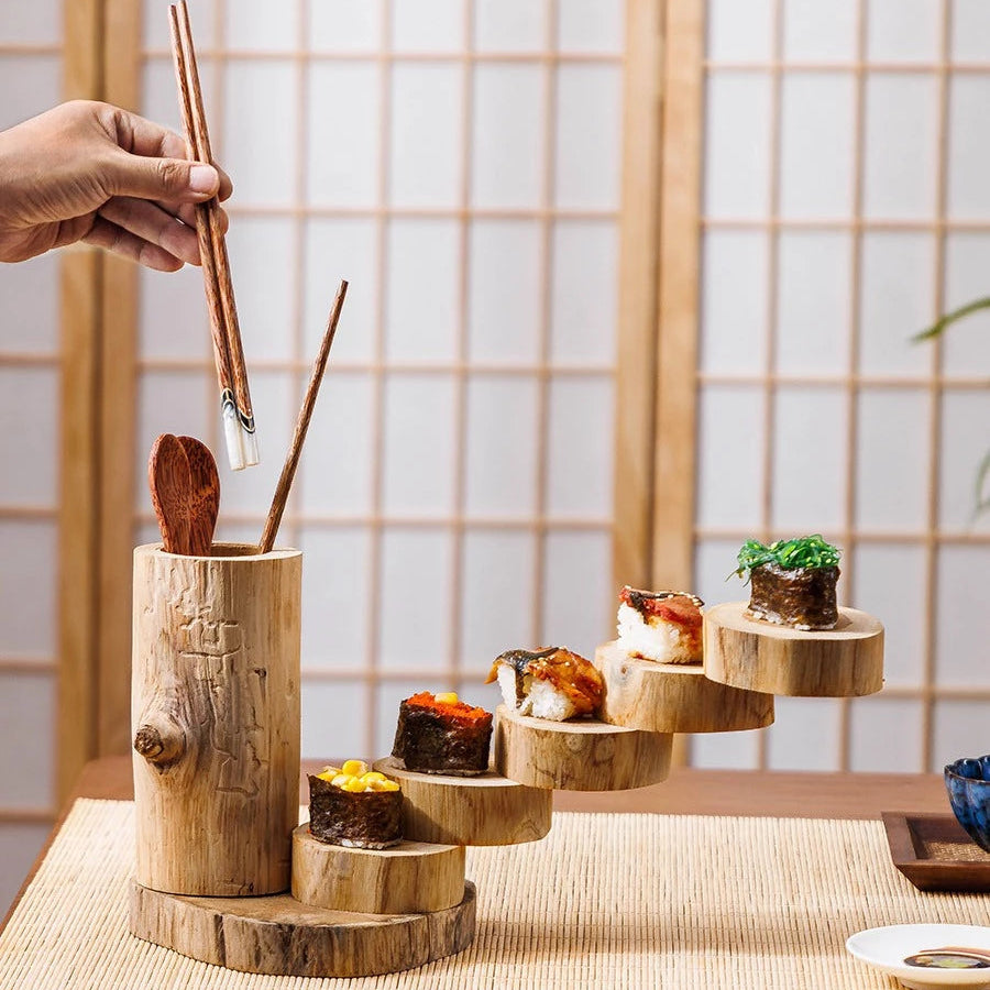 Close-up of the natural wood grain and hand-polished circular trays of the rustic serving stand.