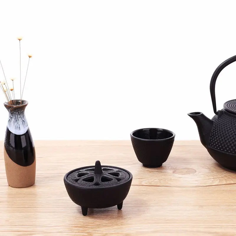 Vintage black cast iron incense burner for cones, featuring a classic tripod design for Zen home decor and tea ceremonies.