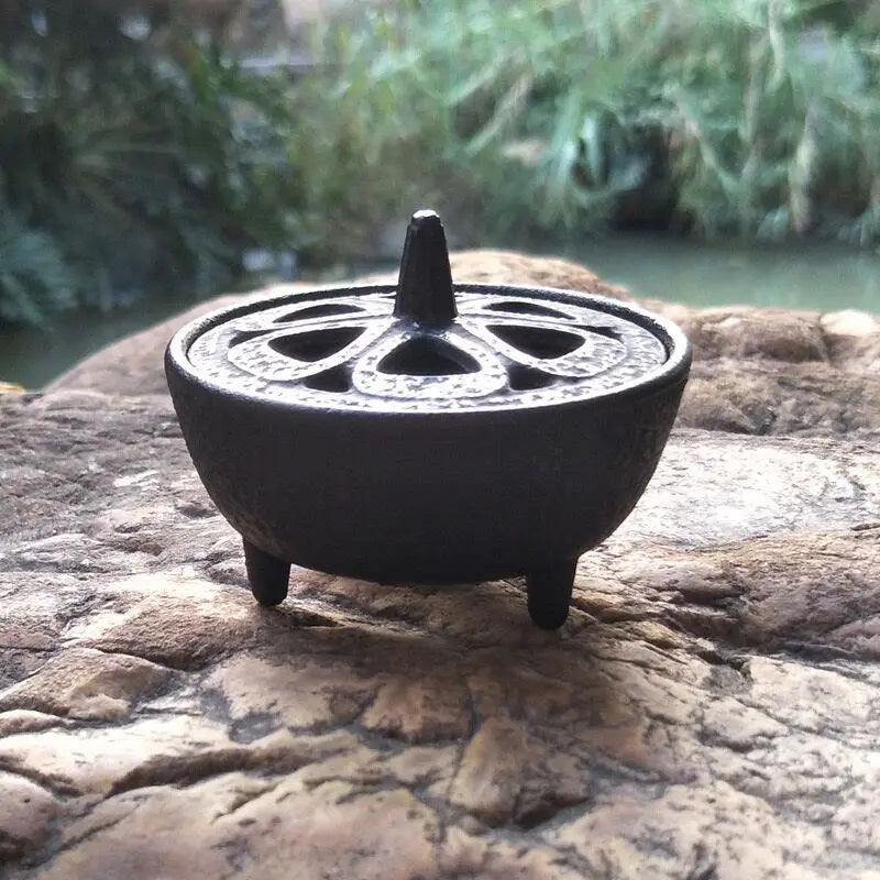Vintage black cast iron incense burner for cones, featuring a classic tripod design for Zen home decor and tea ceremonies.