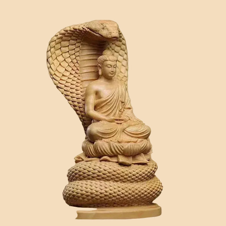 Hand-carved natural Cypress wood Shakyamuni Buddha statue protected by a Naga snake, perfect for Zen home decor and meditation spaces.