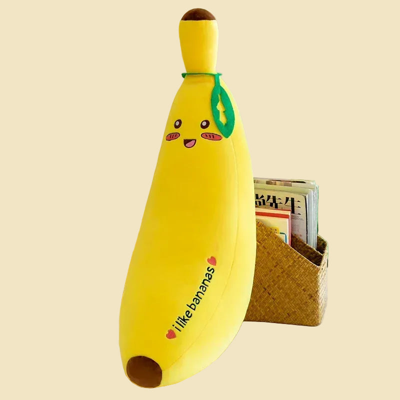 Three yellow giant banana plush body pillows in different sizes, featuring cute kawaii embroidered faces