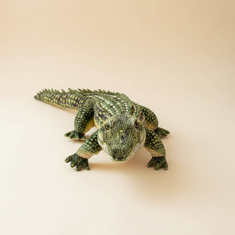 Giant realistic crocodile plush toy body pillow on a bed