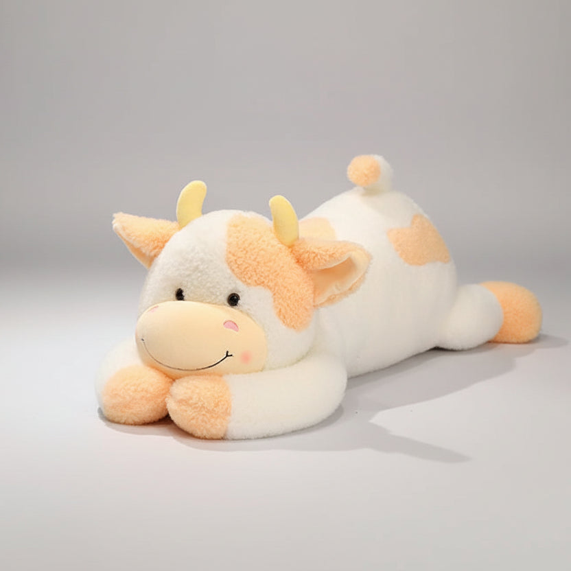 Giant black and white milk cow plush body pillow on bed