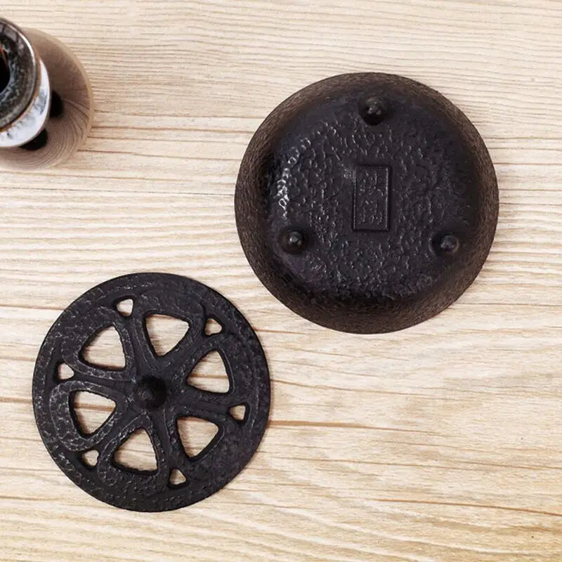 Vintage black cast iron incense burner for cones, featuring a classic tripod design for Zen home decor and tea ceremonies.