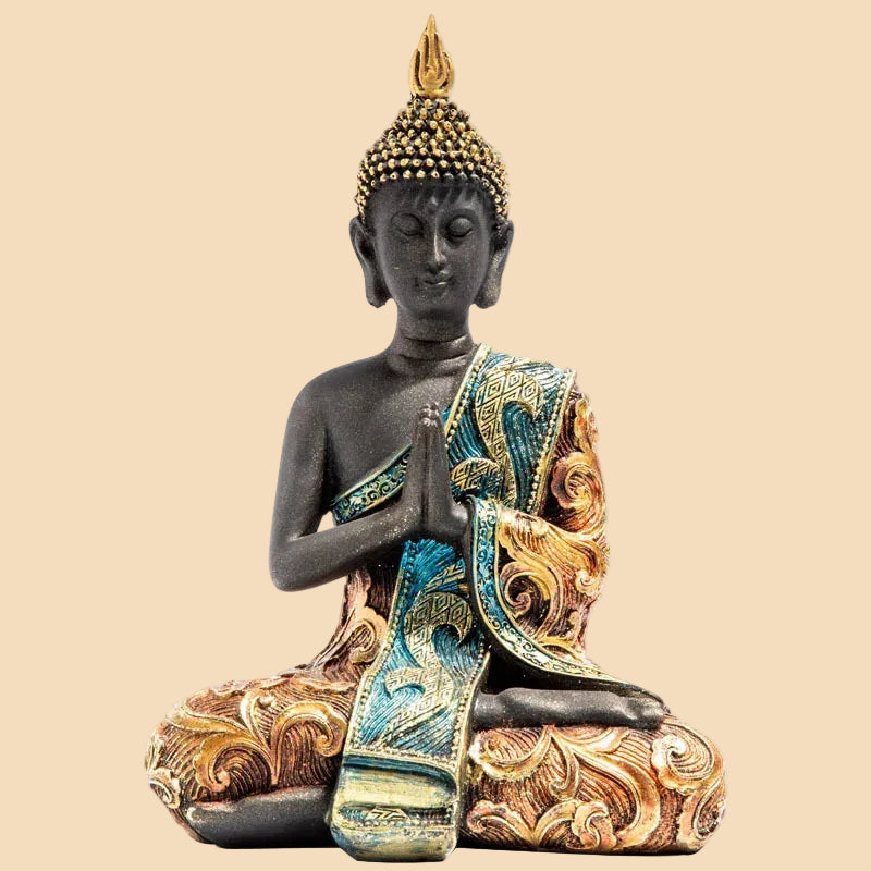 Large dark resin Thai Buddha statue in meditation pose, wearing an intricate gold and turquoise robe, perfect for Zen home decor.