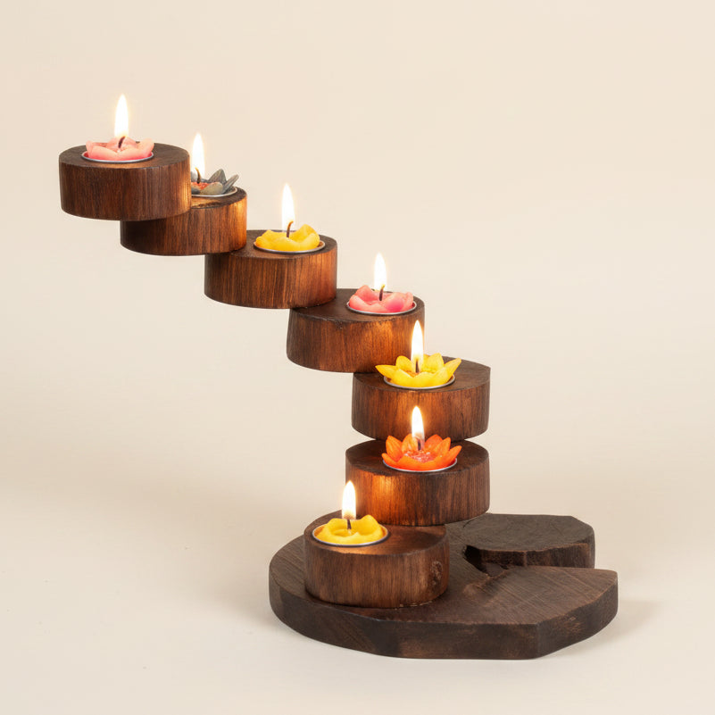 Hand-carved rustic wood candle holder featuring a multi-tier spiral design, ideal for a vintage dining table centerpiece and cozy home decor.