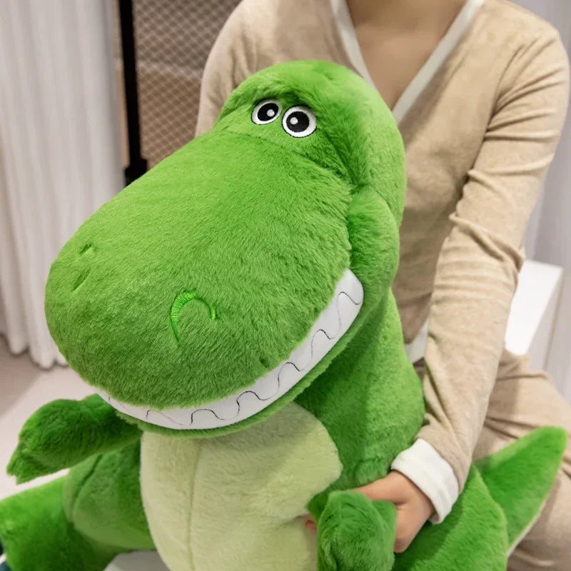 A giant, ultra-soft green dinosaur plush toy being hugged, perfect for kids and dinosaur lovers.