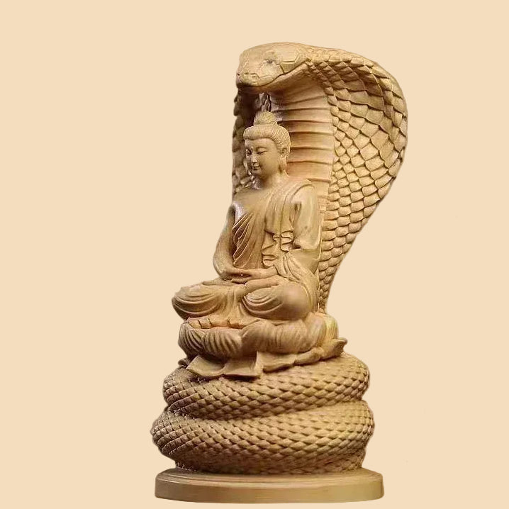 Hand-carved natural Cypress wood Shakyamuni Buddha statue protected by a Naga snake, perfect for Zen home decor and meditation spaces.