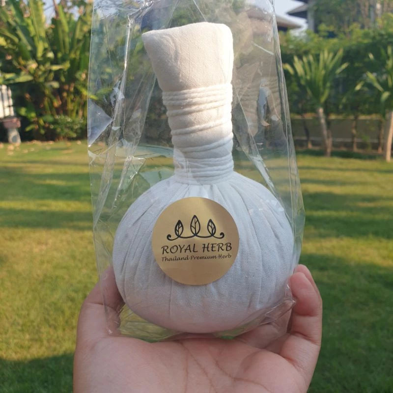 Traditional Thai herbal compress ball for hot massage therapy, featuring organic herbs for muscle relief and spa relaxation.