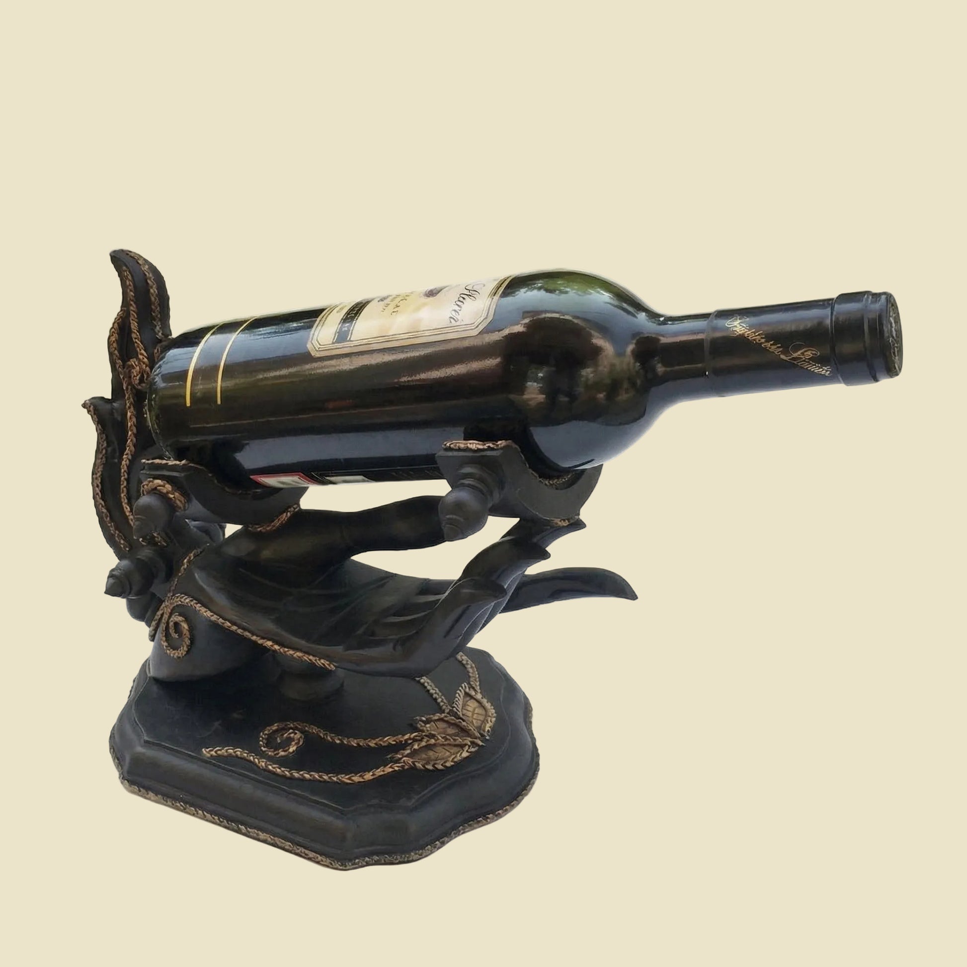 Unique handcrafted Thai Rain Tree wood wine bottle holder in a hand-shaped design with woven rattan accents, displayed on a tabletop.